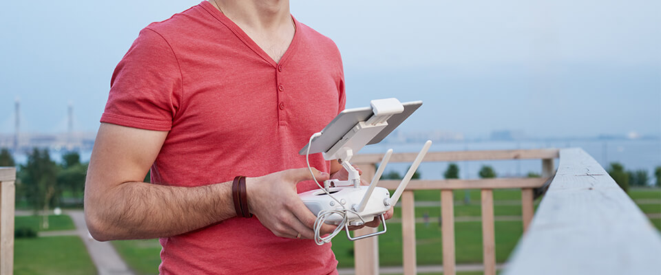 Man operating a drone